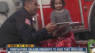 Firefighters deliver presents to kids they rescued