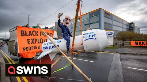 Extinction Rebellion (XR) activists block Amazon depots across the UK during Black Friday