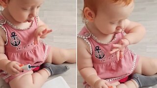 Adorable Baby Girl Applies Nail Polish Like A Real Manicurist