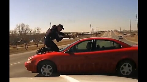 Shocking: Cop Clings To Car Hood As Suspect Flees