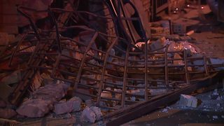 Driver trapped inside their car after hitting a building on St. Clair Avenue