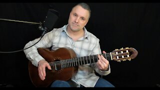 How to hold the acoustic guitar