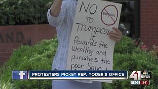 Protesters picket Rep. Kevin Yoder’s office