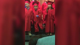 Funny Kid Can’t Stand Still In A Preschool Graduation Choir