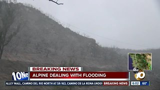 Alpine area hit by brush fire dealing with flooding