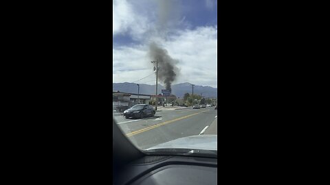 Car burning down in a parking lot
