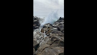 Wave crashing a shore near San Simeon California.