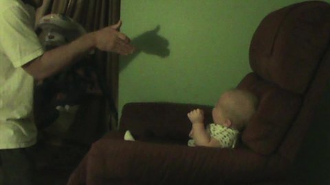 "Dad Makes Shadow Puppets for His Baby Boy"