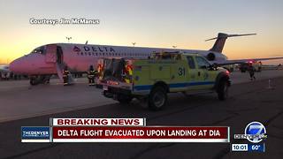 Delta flight from Detroit evacuated upon landing in Denver after smoke reported on plane