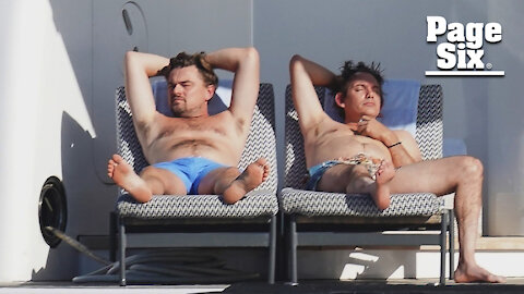 Shirtless Leonardo DiCaprio lounges on a yacht with p—y posse pal Lukas Haas