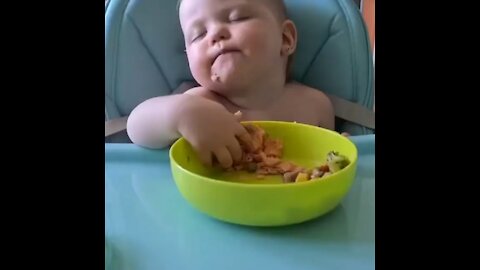 baby can't decide if he wants to sleep or eating