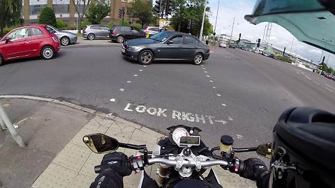 Biker Spontaneously Helps Man In Deed At Busy Intersection
