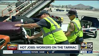 Workers on the tarmac trying to keep cool during extreme heat