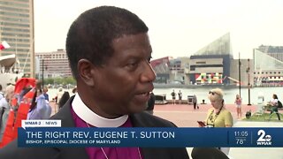 Religious leaders hold prayer circle for Inner Harbor shooting