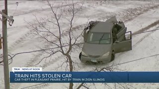 Robbery suspects' stolen vehicle gets hit by freight train