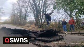 Underground movements left road destroyed and now locals utilise the damaged tarmac