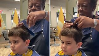 Hair stylist incredibly comforts extremely sensitive kid