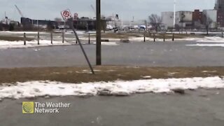 Parking lot flooded on windy day in Port Colborne