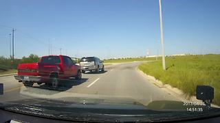 Truck attempts to run SUV off road