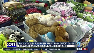 Comfort Cases holding Pack-a-Trolley donation drive