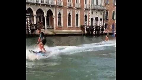 Australian tourists whizzing along Venice's busiest canal