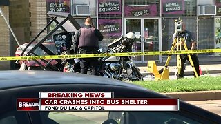 Car crashes into bus shelter