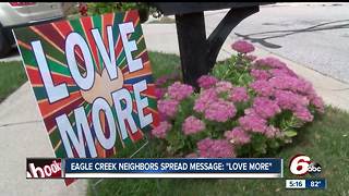 Woman hands out 'love more' signs in Indianapolis neighborhood