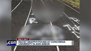 Police search for suspects who spray painted racist graffiti on college track