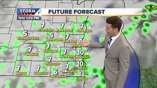 Mostly cloudy with a few showers Thursday