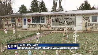 Veteran facing eviction spray paints his home