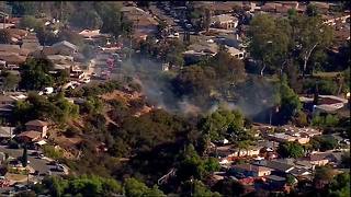 Fire burns dangerously close to homes in canyon