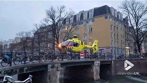 Helicopter lands on Amsterdam Canal