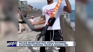 Police investigating after group captured throwing scooters in Detroit River, damaging property around city