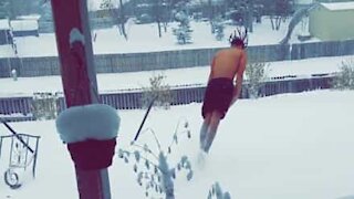 Guy takes morning snow-dive to wake up