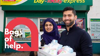 A shop is giving away facemasks and hand gel to OAPs