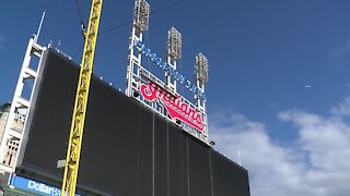 Crews begin to remove the Indians script sign from Progressive Field