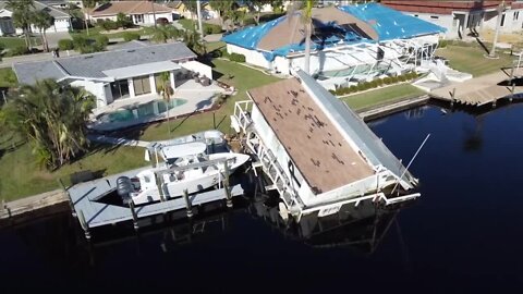 Cape Coral homeowner looking for help as two-story house boat sits on his dock since Hurricane Ian