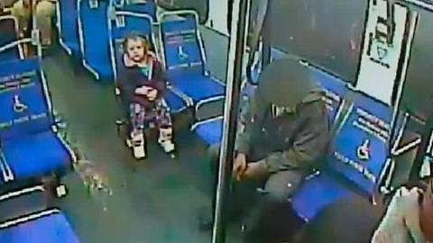 Shivering toddler boards bus alone at night for slushie