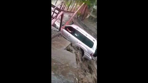 Impatient Driver gets swept away by flood waters.
