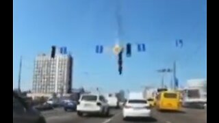 Dashcam Footage Shows Rocket Debris Crash Into Kyiv Traffic