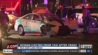 Woman ejected from taxi during crash