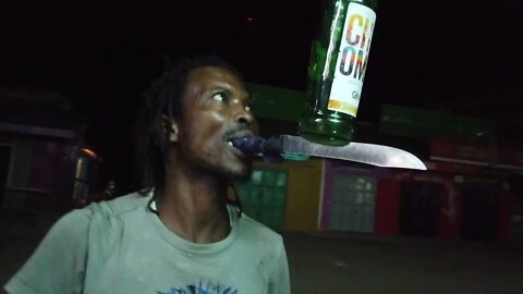 Guy Balances & Flips Bottles on a Knife in His Mouth in Mtwapa, Kenya | Street Show, Superstar, Gin