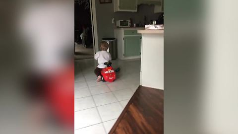 "Toddler Drives Toy Car in Kitchen: Fast and Furious"