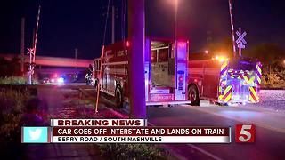 Car Goes Off Interstate, Lands On Train