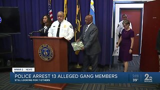 Police arrest 13 alleged gang members, search continues for seven others