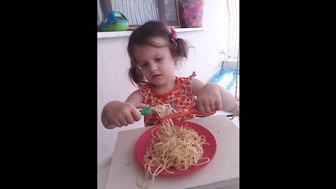 Novel way to eat spaghetti at 3 years old!