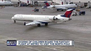 Dozens of children board fantasy flight to North Pole