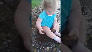 Cute Baby Exploring the Creek