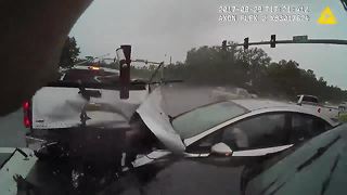 Dramatic video shows truck crashing into officer already at the scene of an accident