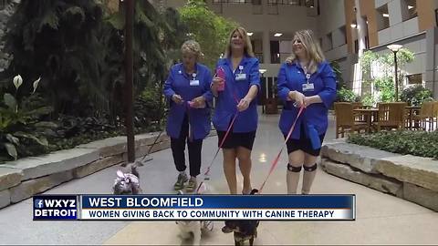 Three generations of women help at Henry Ford West Bloomfield Hospital with therapy dogs and love